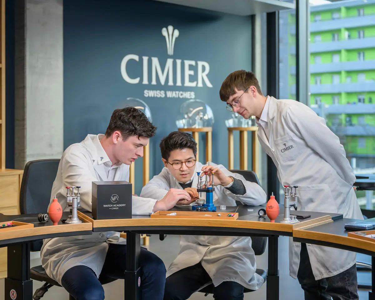 Participants assembling Swiss mechanical watches at the Watch Academy by Cimier workshop in Biel, Switzerland